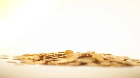 White-gloved hands scooping up a pile of gold coins. They sort out and scatter Stock Footage 122657111