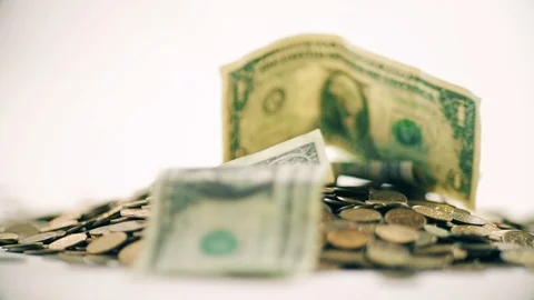 White-gloved hands scooping up a pile of gold coins. They sort out and scatter Stock Footage 122659927