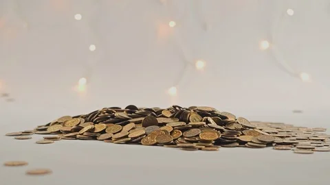 White-gloved hands scooping up a pile of gold coins. They sort out and scatter Stock Footage 122668360