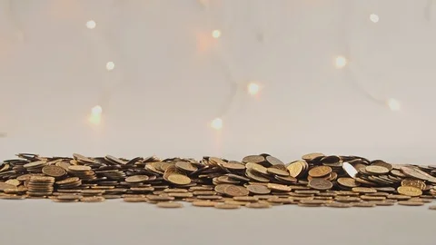 White-gloved hands scooping up a pile of gold coins. They sort out and scatter Stock Footage 122680415