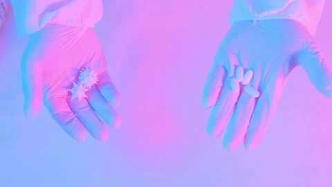 White gloves shows a choice of virus covid or treatment Stock Footage 131376591