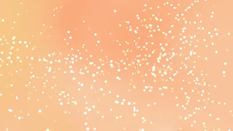 White Glowing Particles Floating on Soft Peach Background Видео 334493870