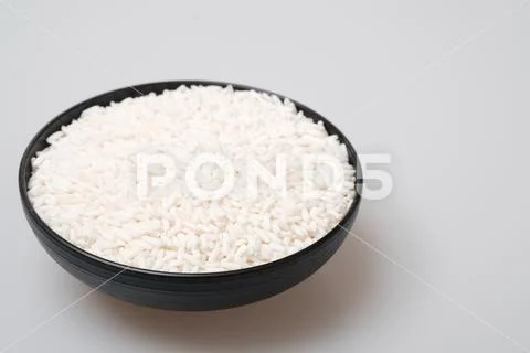 White glutinous rice isolated on white background. Stock Photos