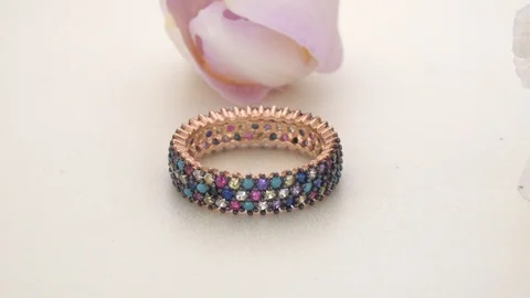 White Gold Eternity Ring Colored paved diamonds Stock Footage 119926005