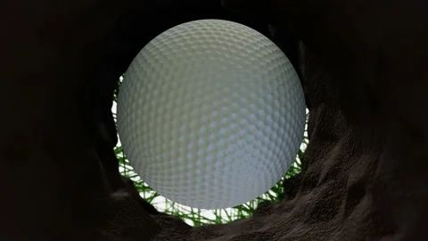 A white golf ball falls into the hole on the golf course. view from the bottom o Stock Footage 233264993