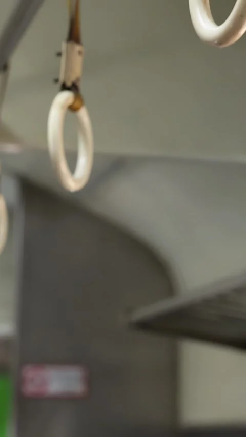 White Grab Handles Swaying Inside a Moving Public Transit Train Vidéo 328575565