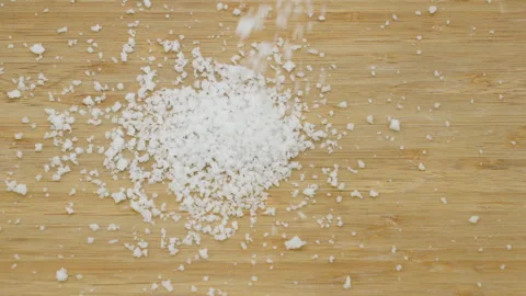 White Granules or Crushed Supplement Powder on Wood Surface Stock Footage 340244834