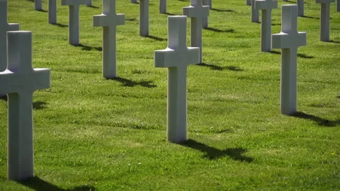 White grave crosses at American war cemetery honoring military service Stock Footage 334729086