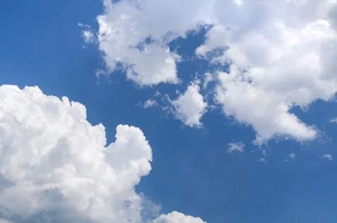White gray clouds in clear blue sky background Stock Photos