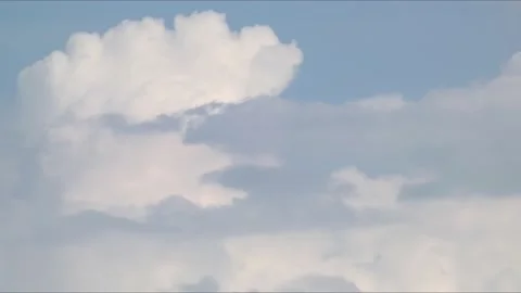 White-gray cumulus clouds floating in the sky like the surf of sea waves Stock Footage 158238764