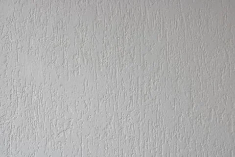 White grunge structural plaster texture background.White roller plaster Stock Photos
