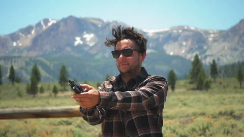 White guy clears Glock 9mm handgun and fires multiple rounds at shooting Video stock 203861431