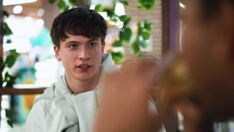 White guy giving questioning look to friend Stock Footage 318227532