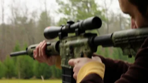 White guy shooting Guns, AR 15  Stock Footage 10701081