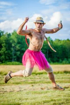 White guy with wings on his back. He displays bow with arrow. Cupid on Valent Stock Photos