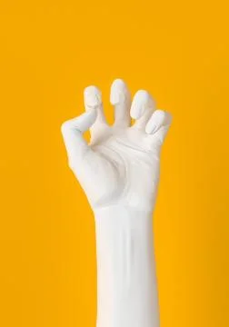 White Hand squeeze gesture isolated on yellow. Female hand sculpture 3d rende Illustrazione stock