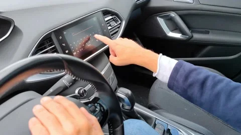 White hand typing Amsterdam Netherlands in car navigation system Stock Footage 211893283
