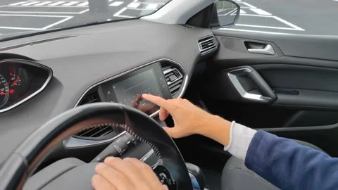 White hand typing City of London UK in car navigation system Stock Footage 211892925
