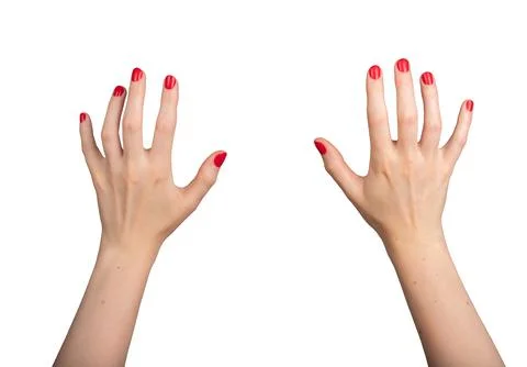 A white hand in a VR virtual reality perspective, reaching forward with a Stock Photos