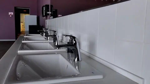 White hand washbasins. an empty cafe in a classic style Stock Footage 157329423