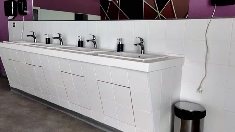 White hand washbasins. an empty cafe in a classic style. interior Stock Footage 165882920