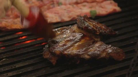 White hands of master chief greasing meat on grill. Stock Footage 79284696