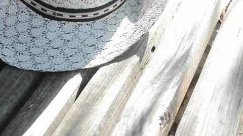 White hat on the bench Stock Footage 95643877