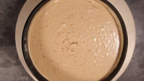 White Hazelnut Spread spinning inside a tub from a top down angle. Stock Footage 329767199