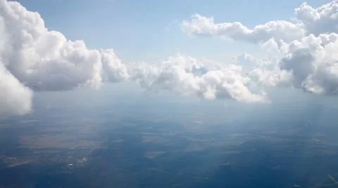 White heap clouds through porthole from inside flying aircraft. Stock Footage 62348236