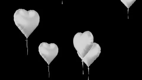 White heart balloons float upwards against black background motion Stock Footage 327594897
