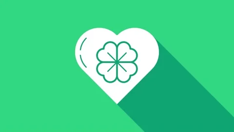 White Heart with four leaf clover icon isolated on green background. Happy Saint Stock Footage 146951791