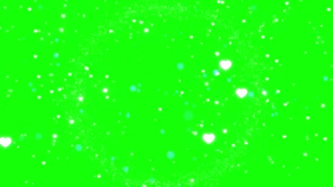 White heart particles and glowing circle frame overlay on a bright green screen Stock Footage 343908690