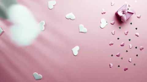 White Hearts Falls Down on table Stock Footage 231719518