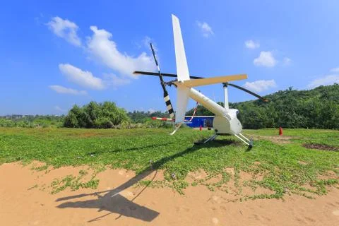 White helicopter on the beach Photos