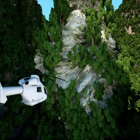 White helicopter flying betweenin Mountains, Cliffs with trees. rescuer. aerial  Stock Footage 69544620