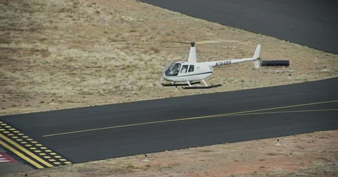 White Helicopter Hovering Stock Footage 77871442