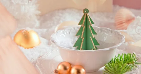 White holiday table setup with baubles, ornaments, and snow. Stock Footage 346556609