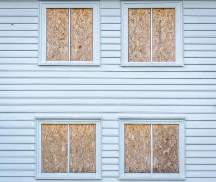 White house with closed windows by timber Stock Photos
