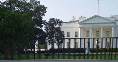 White House Washington D.C., gardner cutting North lawn with sound. Stock Footage 138707767