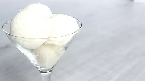 White ice-cream balls are pouring liquid caramel Stock Footage 63391300