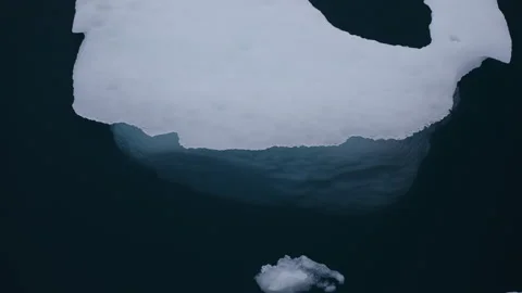 White Ice Piece Drifting On Calm Water Stock Footage 337792080