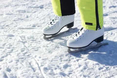 White ice skates on snow, winter sports and leisure detail Stock Photos