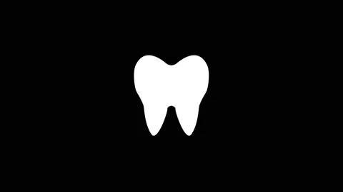 White icon of tooth appears on a black background. Stock Footage 219742372