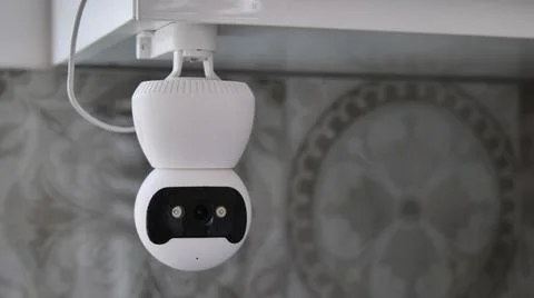 White Indoor Security Camera Mounted on Ceiling Stock Photos
