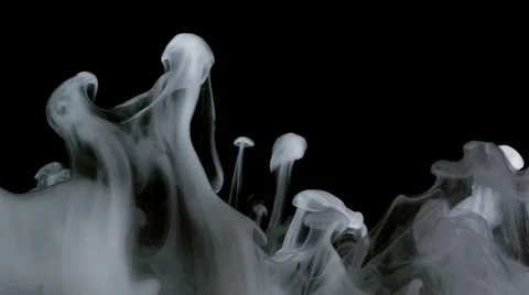 White ink and particles slowly ascending like smoke in slow motion Stock Footage 44239694