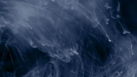 White ink and particles slowly floating like Stock Footage 100538289