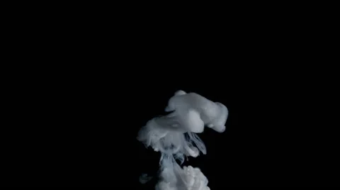 White ink ascending like smoke from an explosion, black background Stock Footage 57781055