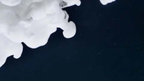 White ink like a big smoke column from an explosion on black background Stock Footage 84615802