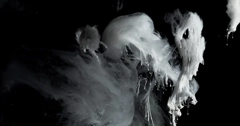 White ink clouds and threads with depth of field like smoke from an explosion Stock Footage 113631830