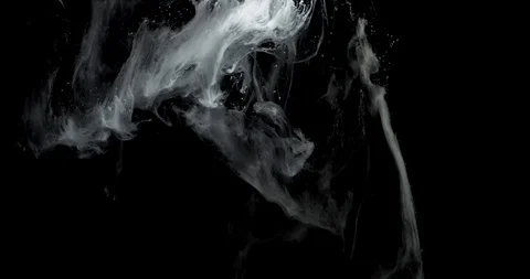 White ink clouds and threads with depth of field against black background Stock Footage 113634781